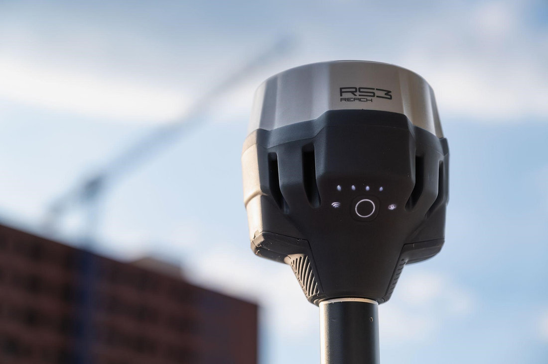 Emlid Reach RS3 GNSS receiver on a survey tripod